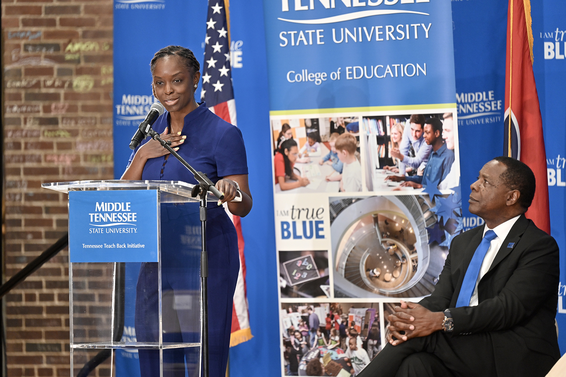 Neporcha Cone, left, the new College of Education dean for Middle Tennessee State University, expresses her excitement about MTSU’s Tennessee Teach Back Initiative — an effort to create a teacher pipeline to high-needs school districts — at a signing ceremony between the university and initiative partner the State Collaborative on Reforming Education, or SCORE, held Monday, May 8, at Homer Pittard Campus School in Murfreesboro, Tenn. At right is MTSU President Sidney A. McPhee. (MTSU photo by J. Intintoli)