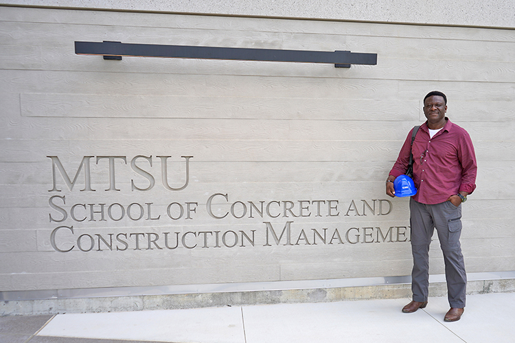 In this spring 2023 photo, Bennie Thompson, a Middle Tennessee State University rising senior concrete industry management major and Honors Transfer Fellow from Fayetteville, Tenn., is shown outside of the School and Concrete and Construction Management Building on the MTSU campus. (MTSU photo by Robin E. Lee)