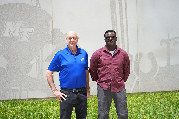 In this spring 2023 photo, Bennie Thompson, right, a Middle Tennessee State University rising senior concrete industry management major and Honors Transfer Fellow from Fayetteville, Tenn., is pictured with Kelly Strong, director of the School and Concrete and Construction Management, outside of the SCCM building on the MTSU campus. (MTSU photo by Robin E. Lee)