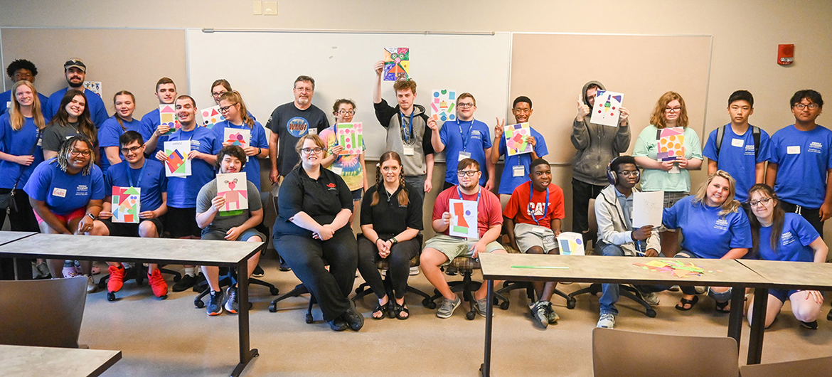 Campers who attended the Middle Tennessee State University Inclusive College Experience camp show off their abstract art creations at the College of Education building June 23, 2023, on campus. (MTSU photo by Stephanie Wagner)