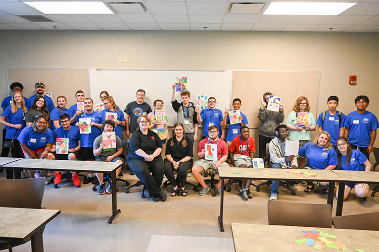 Campers who attended the Middle Tennessee State University Inclusive College Experience camp show off their abstract art creations at the College of Education building June 23, 2023, on campus. (MTSU photo by Stephanie Wagner)