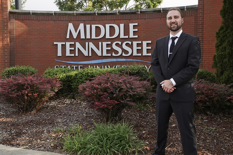 Middle Tennessee State University senior integrated studies major Devin Hill of Smyrna, Tenn., shown here at one of the campus entrances, will graduate this summer after returning to MTSU after 10 years to earn his degree thanks to the Adult Degree Completion Program. (Submitted photo)