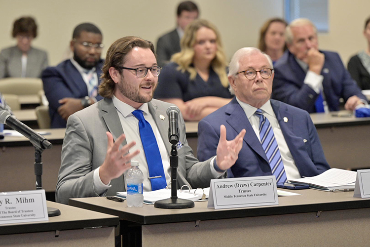 Outgoing Middle Tennessee State University Student Trustee Andrew (Drew) Carpenter gives remarks at the MTSU Board of Trustees quarterly meeting held Tuesday, June 20, in the Miller Education Center on Bell Street. Listening at right is Trustee J.B. Baker. (MTSU photo by Andy Heidt)