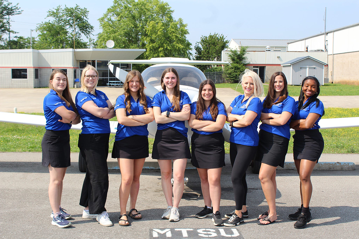 Middle Tennessee State University’s Air Race Classic 2023 pilots and ground crew await the start of this year’s event. The group, from left, includes pilot Alyssa Smith, Katie Thayer, Hailey Harrison, coach Meredith Boardman, pilot Briana “Bri” McDonald, Denisa Pravotiakova, Rachel Frankenberger, and pilot Farilyn Hurt. From Murfreesboro and the MTSU Flight Operations Center, ground crew members helped the pilots navigate 2,400 miles from Grand Fork, N.D., to Homestead, Fla. MTSU placed 28th overall among the nearly 50 participating teams. (MTSU photo by Merideth Boardman)