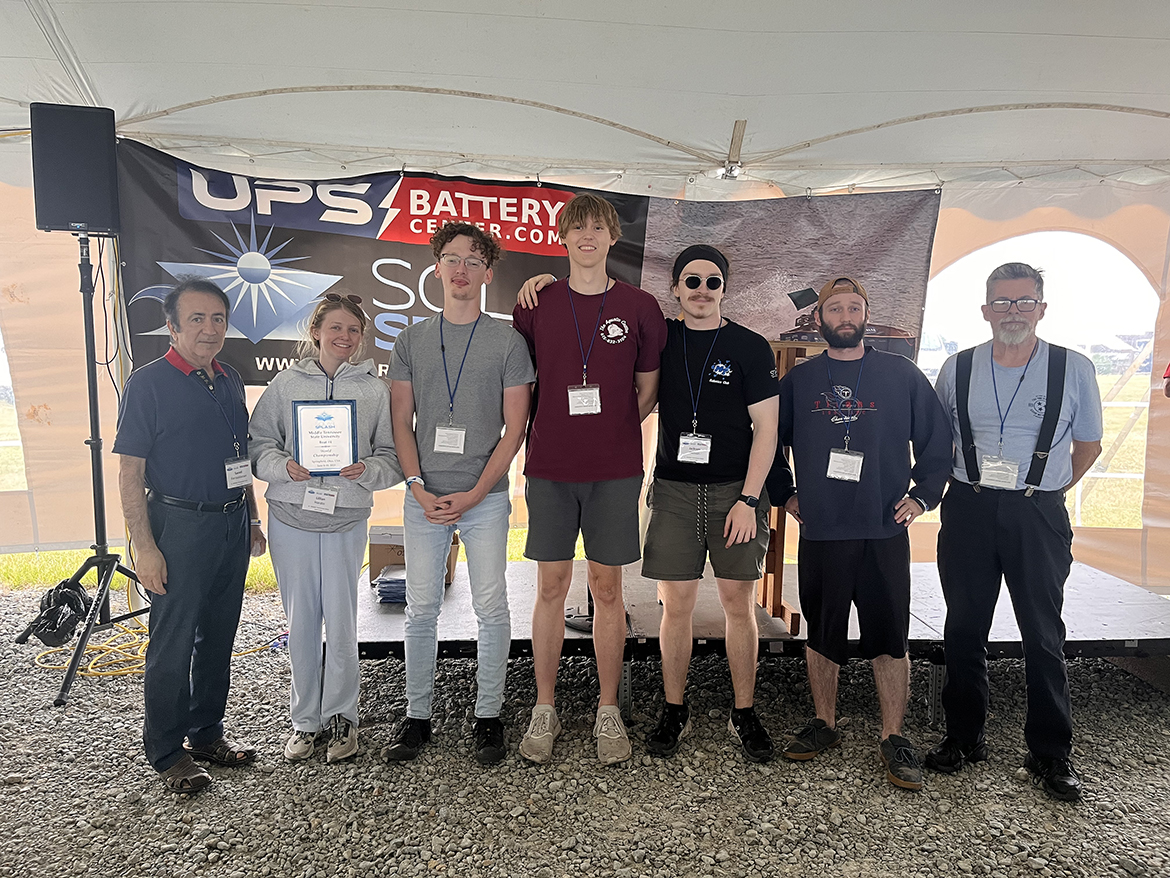 Middle Tennessee State University solar boat team members await results from the 2023 Solar Splash world competition recently at Springfield, Ohio. The team included, from left, Saeed Foroudastan, director of the MTSU Experimental Vehicles Program; co-captain Lily Hardin; Cody Olsen; Daniel Wetter; Jackson Clemons; Zachary DiNovo; and Rick Taylor, lab manager for the Department of Engineering Technology. (Submitted photo)
