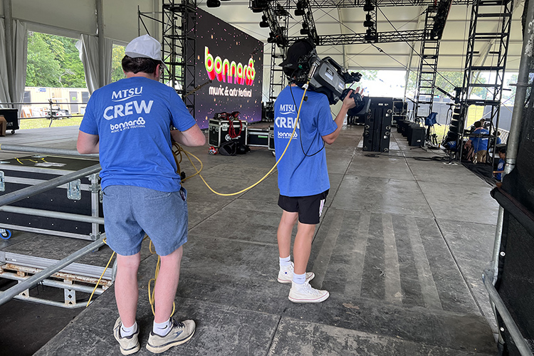 Students from MTSU College of Media and Entertainment prepare a camera to be used on Bonnaroo’s “This” stage as part of the university’s assignment to handle live TV production for streaming service Hulu of 25 concerts during the four-day festival. (MTSU Photo by Andrew Oppmann)