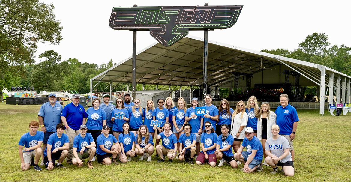 A group shot of some members of the team of about 50 MTSU students and faculty on this year’s coverage team at the 2023 Bonnaroo Music and Arts Festival. It’s a coveted assignment for students, as it provides a resume boost and talking points for job seekers in entertainment journalism, music business and audio and video production. (MTSU Photo by James Cessna)
