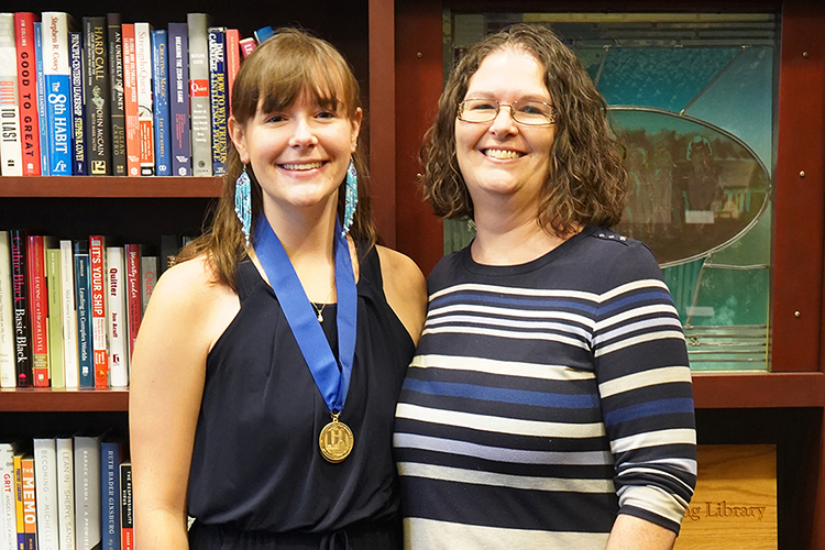 Wearing an honors medallion in this undated photo, Catheryn Bolick of Smyrna, Tenn., left, a spring Middle Tennessee State University Honors College graduate and Buchanan Fellow, poses with her mother, Kelly. Bolick is one of 62 recipients nationwide to receive Phi Kappa Phi Fellowship for 2023 and will pursue a doctorate in cancer cell biology at Washington University in St. Louis, Mo. (Submitted photo)