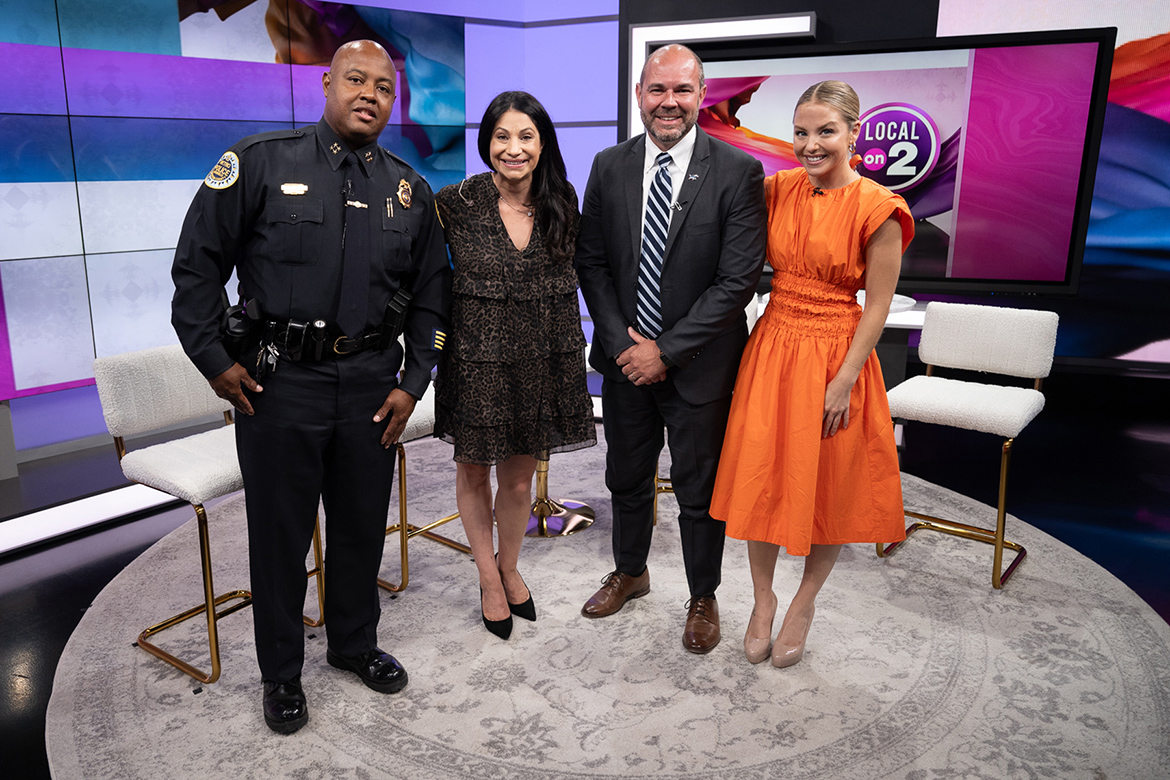 Metro Nashville Assistant Police Chief Dwayne Greene, left, and John Burchfield, third from left, associate dean of MTSU University College, pose June 26 with the co-hosts of the WKRN News Local on 2 program at the station’s Nashville, Tenn., studios. They appeared to discuss the benefits of the university’s new public safety concentration geared toward helping working professionals like those on Metro Nashville’s police force earn their bachelor’s degree. Interviewing them was host Laura Schweizer, far right, and co-host Larissa Wohl, second from left. (MTSU photo by James Cessna)