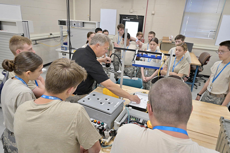 John Rozell, center, director of Research and Development Labs in the Department of Engineering Technology at Middle Tennessee State University, performs a demonstration Tuesday, July 11, inside the university’s Voorhees Engineering Technology Building for Civil Air Patrol cadets attending the weeklong National Cadet Engineering Technology Academy, also known as E-Tech, to expose them to a variety of science and engineering fields. (MTSU photo by Andy Heidt)