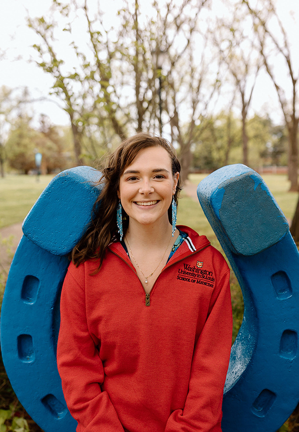 In this undated photo, Catheryn Bolick, a spring 2023 Middle Tennessee State University Honors College graduate from Smyrna, Tenn., poses for a photo at the blue horseshoe in Walnut Grove wearing a Washington University red fleece. Bolick is one of 62 recipients nationwide to receive Phi Kappa Phi Fellowship and will pursue a doctorate in cancer cell biology at Washington University in St. Louis, Mo. (Submitted photo)