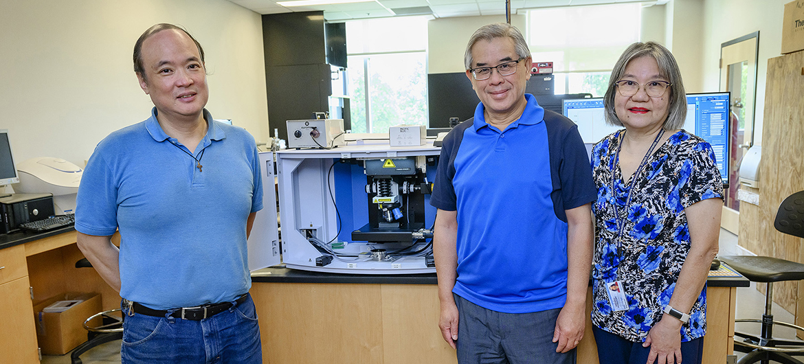 Middle Tennessee State University chemistry faculty, from left, Charles Chusuei, Sing Chong and Beng Guat Ooi are shown Thursday, Aug. 18, at the Science Building on campus in front of a specialized Raman confocal microscope, one of the department’s four recently acquired, cutting-edge pieces of chemistry instrumentation that they hope will expand research and hands-on experience opportunities for faculty and students. (MTSU photo by J. Intintoli)