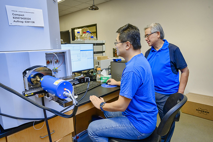 Middle Tennessee State University chemistry faculty Mike Zhang, left, and Sing Chong use the department’s new state-of-the-art liquid chromatograph coupled to a high resolution mass spectrometer on Thursday, Aug. 18, at the Science Building on campus. The device is one of four recently acquired, cutting-edge pieces of chemistry instrumentation that Zhang, Chong and other faculty helped acquire through grant funds with hopes to expand research and hands-on experience opportunities for faculty and students. (MTSU photo by J. Intintoli)