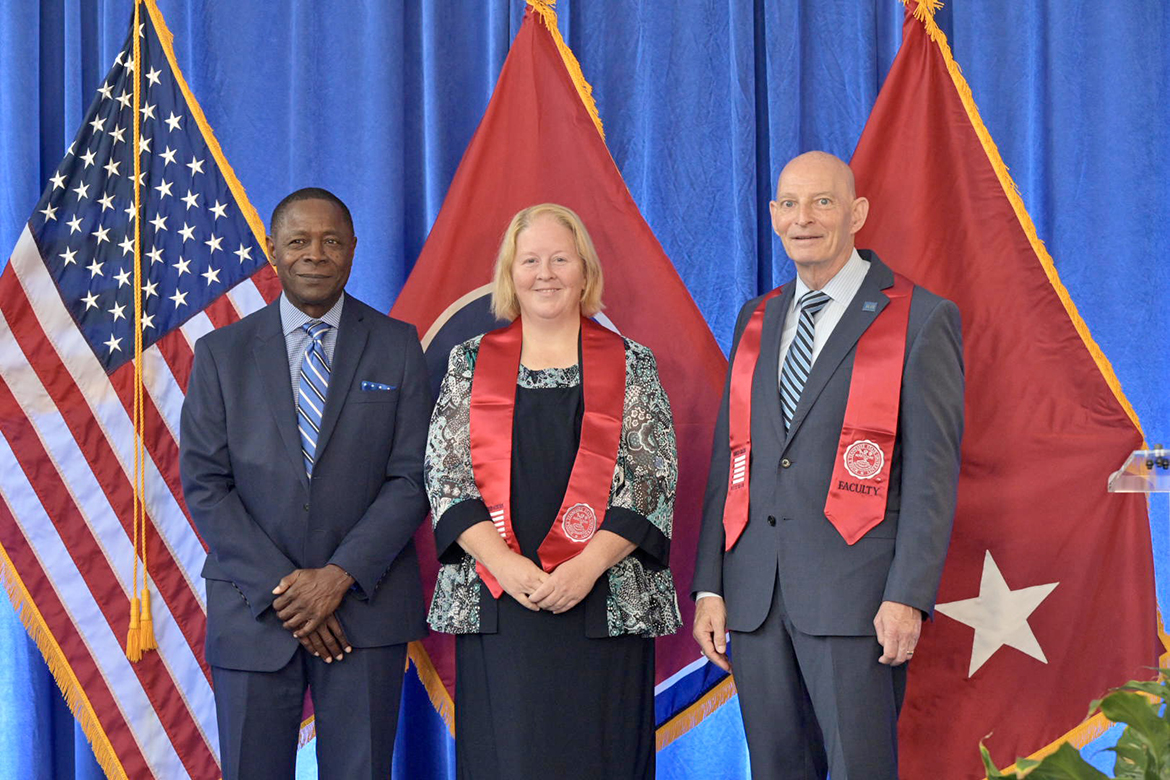 Middle Tennessee State University President Sidney A. McPhee, left, graduating student-veteran Kristin Burton of Murfreesboro, Tenn., and Keith M. Huber, MTSU senior adviser for veterans and leadership initiatives, are shown during the Daniels Veterans Center’s Graduating Veterans Stole Ceremony Thursday, Aug. 10, in the second-floor atrium of the Miller Education Center on Bell Street. (MTSU photo by Andy Heidt)
