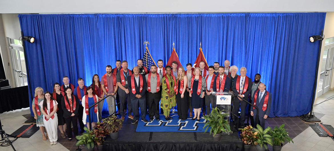 Joined by faculty and staff also recognized, Middle Tennessee State University student-veterans pose for a group photo Thursday, Aug. 10, during the Charlie and Hazel Daniels Veterans and Military Family Center’s Graduating Veterans Stole Ceremony in the second-floor atrium of the Miller Education Center on Bell Street. More than 40 student-veterans will graduate at 9 a.m. Saturday, Aug. 12, in Murphy Center. (MTSU photo by Andy Heidt)