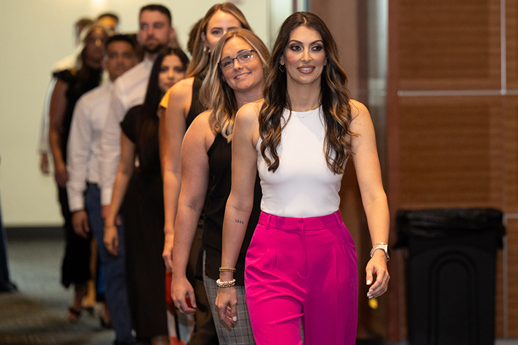 Students in the inaugural cohort of the Middle Tennessee State University Physician Assistant Studies Program march into the Student Union Ballroom on Aug. 11, 2023, to celebrate the transition from classroom to clinic rotations at the first “white coat” ceremony. (MTSU photo by James Cessna)