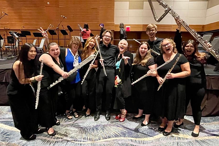 Middle Tennessee State University students and a faculty member take a fun group photo after a performance in the Phoenix Convention Center Ballroom in Phoenix, Arizona, on Aug. 6, 2023. The eight students were selected to attend the convention, along with Deanna Little, their flute professor, after a lengthy audition process. Standing, from left, are Italee Philom; Sarah Potts; Little; Chelsea Liu, Jakob Young, Lisa Garner Santa, Collegiate Flute Choir conductor; Katie Beatty; Jonathan Oldham; Olivia Guthier and Alyssa Jones. (Submitted photo)