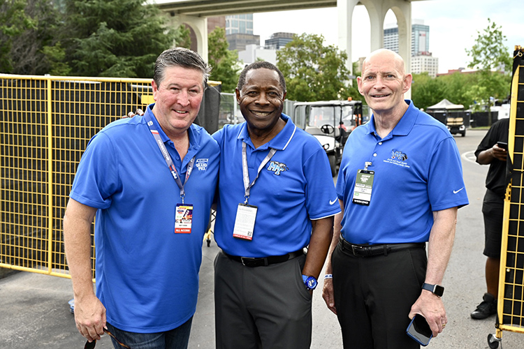 From left, Middle Tennessee State University alumnus Matt Crews, founder and CEO of the Big Machine Music City Grand Prix, MTSU President Sidney A. McPhee, and retired Army Lt. Gen. Keith Huber, MTSU senior adviser of veterans and leadership initiatives, pause for a photo while chatting Friday, Aug. 4, at the race site in downtown Nashville, Tenn. (MTSU photo by James Cessna)