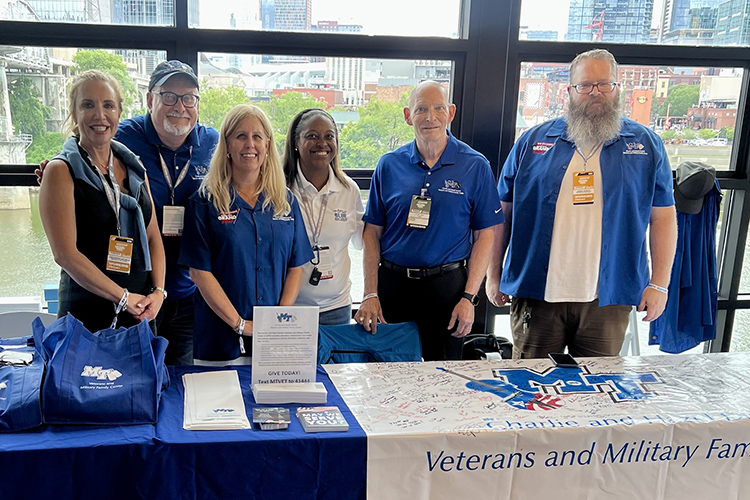 Middle Tennessee State University representatives from the Charlie and Hazel Daniels Veterans and Military Family Center and Division of Marketing and Communications staff the information table set up Aug. 4 at the Patriots’ Outpost as part of the Big Machine Music City Grand Prix in downtown Nashville, Tenn. Pictured, from left, are Hilary Miller, Andrew Oppmann, Betsy Allgood, Mealand Ragland-Hudgins, Keith Huber and Jeremy Winsett. (MTSU photo by Andrew Oppmann)