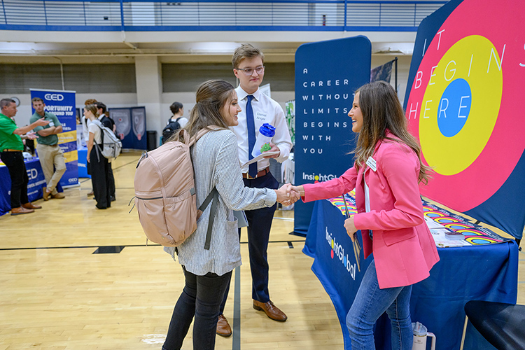 From left, Middle Tennessee State University students Ella Connor and Daniel Anger, both of Brentwood, Tenn., talk to staffing firm Insight Global’s representative Lauren Chaverin Thursday, Sept. 28, at the 2023 Fall Career Fair inside the Campus Recreation Center. Representatives from almost 180 employers met with 1,000-plus students and alumni at the event, which was hosted by the MTSU Career Development Center. (MTSU photo by J. Intintoli)