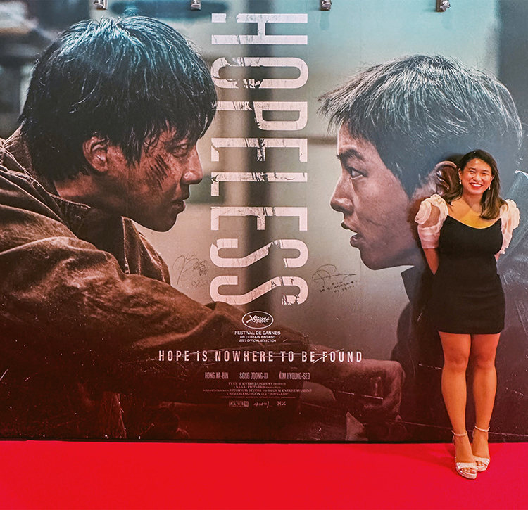 MTSU alumna Beatriz Marie Dedicatoria (Class of ’20) is shown May 24 at Marché du Film inside the Cannes International Film Festival in France where she completed an internship. Dedicatoria, who is standing in front of the film poster of “Hopeless,” a South Korean film that premiered at the festival, said she was able to attend the premiere and meet the cast and crew. (Submitted photo)