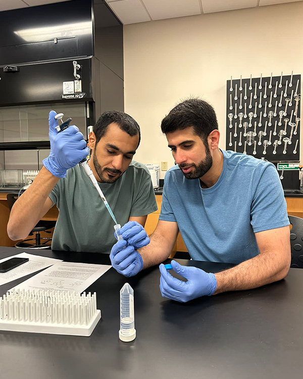 Dubai Police Force students, left, Rashid Almutairi and Obaid Mohammed, work on experiments in a forensic lab as part of the Business Analytics and Forensic Science Global Study program at Middle Tennessee State University. (MTSU photo by Nancy DeGennaro)