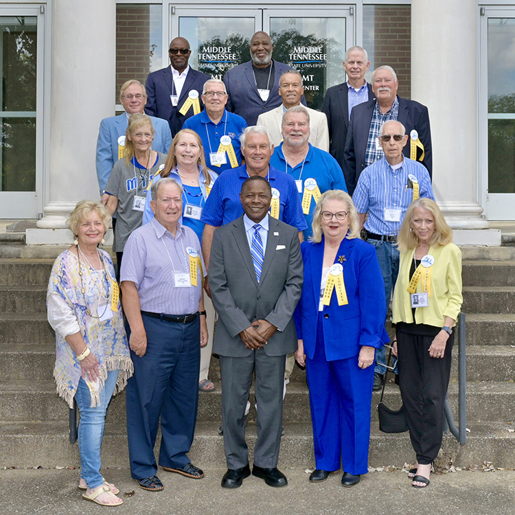 Middle Tennessee State University President Sidney A. McPhee, front row center, poses with the Class of 1973 Golden Raiders who returned to campus for the induction ceremony Friday, Sept. 22, in the MT Center in the Ingram Building. (MTSU photo by Andy Heidt)
