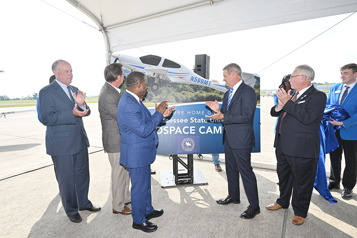 From left, Middle Tennessee State Board of Trustees Chair Steve Smith, Tennessee House Speaker Cameron Sexton, MTSU President Sidney A. McPhee, Gov. Bill Lee and Shelbyville Mayor Randy Carroll unveil the promotional sign for MTSU's new Aerospace Campus to be built at Shelbyville Municipal Airport during a special event Thursday, Sept. 21, to announce the Aerospace Department's eventual move to the airport. (MTSU photo by J. Intintoli)