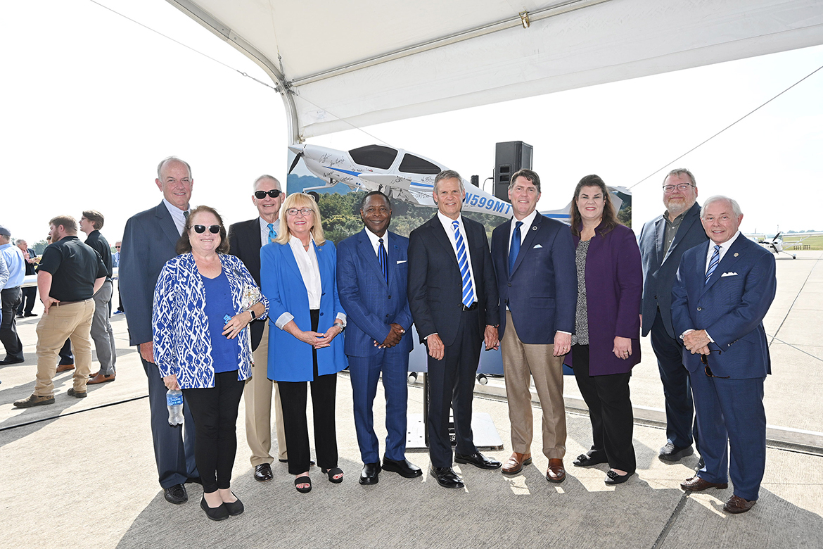Middle Tennessee State University Board of Trustees members and state legislators are shown with MTSU President Sidney A. McPhee, center left, and Gov. Bill Lee, center right, following the announcement of the Aerospace Department's move to the Shelbyville Municipal Airport Thursday, Sept. 21. Pictured, from left, are MTSU Board of Trustees Chairman Steve Smith, Faculty Trustee Mary Martin, Trustee Tom Boyd, Trustee Pam Wright, McPhee, Lee, state Sen. Shane Reeves, state Sen. Dawn White, state Rep. Tim Rudd, and Trustee J.B. Baker. (MTSU photo by J. Intintoli)