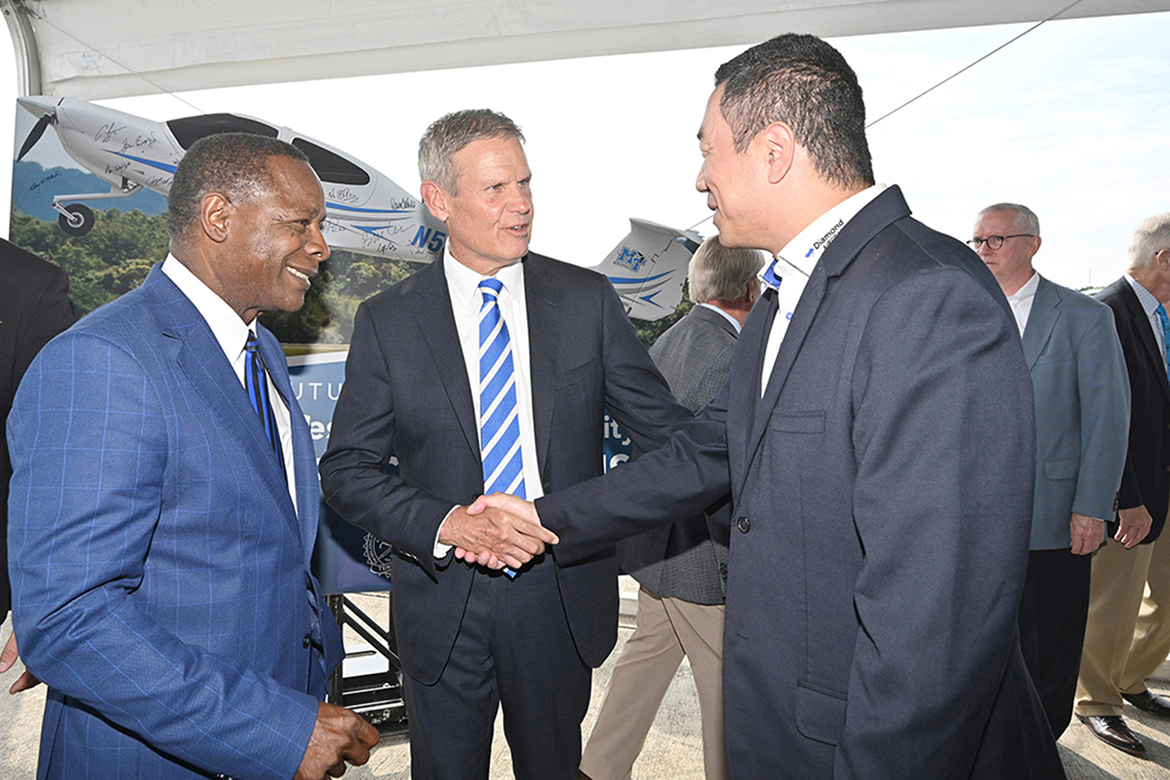 Middle Tennessee State University President Sidney A. McPhee, left, and Tennessee Gov. Bill Lee, center, greet Kevin Sheng, CEO of Diamond Aircraft Canada, Thursday, Sept. 21, during the MTSU Shelbyville announcement of the university’s Aerospace Campus pending construction and move to Shelbyville Municipal Airport. (MTSU photo by J. Intintoli)