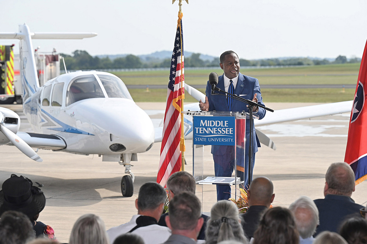 With one of the university’s Piper aircraft parked in the background, Middle Tennessee State University President Sidney A. McPhee addresses a crowd of 200-plus attendees Thursday, Sept. 21, during the MTSU Shelbyville announcement of the university’s Aerospace Campus pending construction and move to Shelbyville Municipal Airport. (MTSU photo by J. Intintoli)