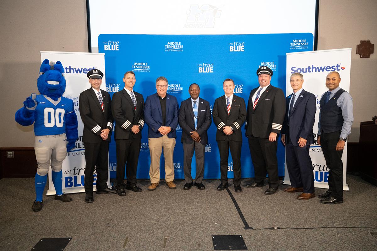 A group photo following the Middle Tennessee State University-Southwest Airlines Destination 225° program partnership signing in the Business and Aerospace Building’s State Farm Lecture Hall includes, from left, MTSU mascot Lightning, Southwest Capts. Sean Strittmatter and Justin Peele, MTSU Provost Mark Byrnes and President Sidney A. McPhee, alumnus and Southwest First Officer Chris Collins, Southwest Capt. Brad Monda and MTSU College of Basic and Applied Sciences Dean Greg Van Patten and Aerospace Chair Chaminda Prelis. The program provides pathways for MTSU students to find careers with Southwest. (MTSU photo by James Cessna)