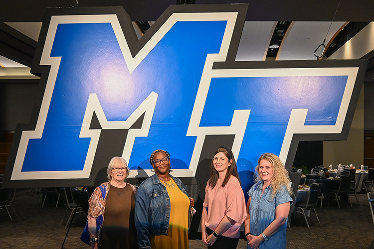 Staff from Stewart’s Creek High School in Smyrna, Tennessee, from left, Ann Stewart, Kavita Lyles, Stephanie Oakes and Johanna Fergus, pose for a photo at the counselor appreciation luncheon as part of Middle Tennessee State University’s True Blue Tour on Wednesday, Sept. 13, 2023, at the Student Union Ballroom on campus in Murfreesboro, Tenn. (MTSU photo by Stephanie Wagner)