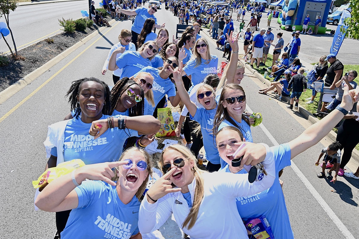 Members of the Middle Tennessee State University softball team pose for a photo Saturday, Sept. 23, during the 2023 Homecoming Parade along East Main Street and Middle Tennessee Boulevard in Murfreesboro, Tenn. (MTSU photo by J. Intintoli)