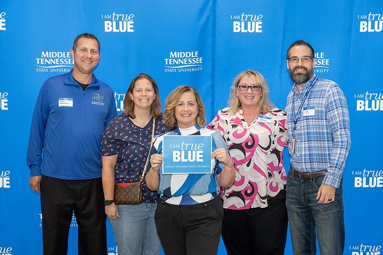 Kevin Krahenbuhl, far left, director of Middle Tennessee State University’s Assessment, takes a photo with attendees at the program’s 10-year celebration event on Sept. 16, 2023, at the Miller Education Center in Murfreesboro, Tenn. Standing, from left, are Krahenbuhl; Tory Atwood; Jennifer Hyde, the program’s executive assistant; Jenni Smith and Lando Carter, an associate professor in the program. (MTSU photo by James Cessna)