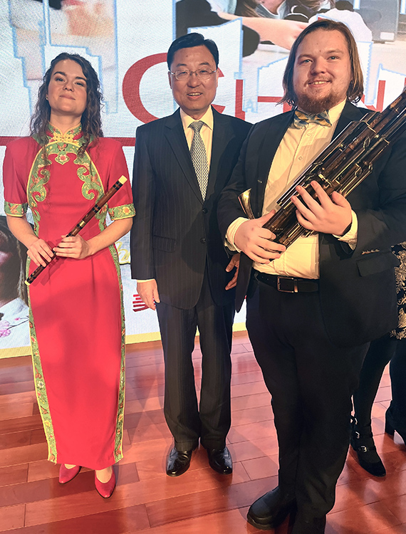 U.S. Chinese Ambassador Xei Feng stands with MTSU Chinese Music Ensemble performers Amy Brown, left, and Will Childress, right, after a concert given at the Chinese Embassy in Washington, D.C., on Oct. 17, 2023. (Submitted photo)