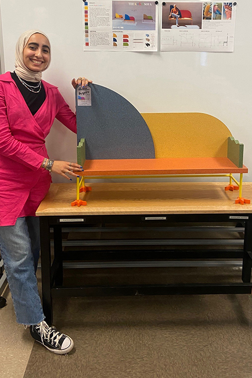 Middle Tennessee State University junior interior design student Leen Hasan from Murfreesboro, Tennessee, stands with her project titled Koko Sofa that earned second place at Formica Form, a national furniture design competition that held regional awards at the Inspire Nashville trade show. As part of the experiential learning, or EXL, capstone course taught by assistant professor Carrie Pavel, students designed a piece of furniture that utilizes Formica as a material in the project based on the theme of maximalism. (Submitted photo)