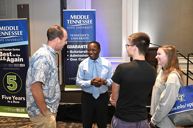 Middle Tennessee State University President Sidney A. McPhee, second from left, talks to prospective MTSU students and their families during the university’s annual True Blue Tour stop at the Cool Springs Marriott in Franklin, Tenn., on Monday, Sept. 25, 2023. (MTSU photo by James Cessna)