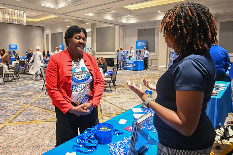 Jackie Collins, a counselor from Nolensville High School in Nolensville, Tenn., chats with a staff member from Middle Tennessee State University at one of the university’s second True Blue Tour recruitment stop at the Cool Springs Marriott in Franklin, Tenn., on Monday, Sept. 25, 2023. (MTSU photo by Stephanie Wagner)