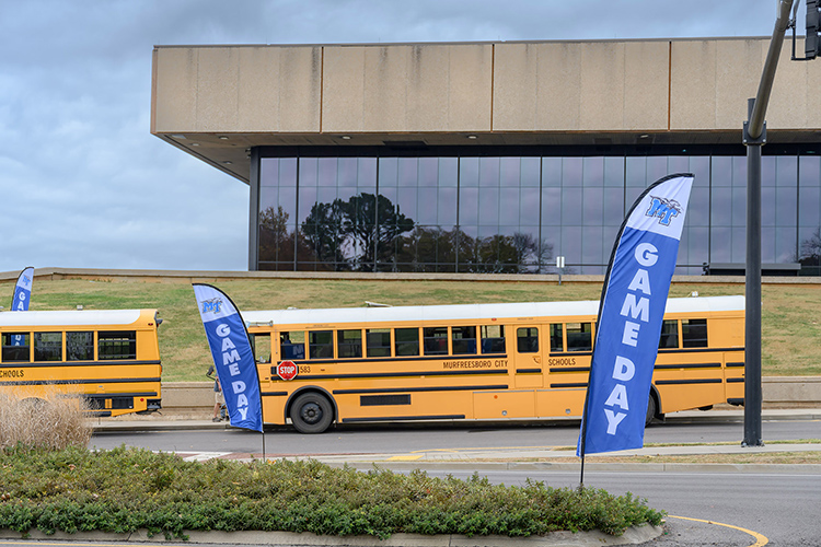 Murfreesboro City Schools buses are stationed outside Murphy Center at Middle State University awaiting conclusion of the 10th annual Education Day game Nov. 9, 2023, attended by thousands of MCS students. The Lady Raiders women’s basketball team defeated the Florida A&M Rattlers by a score of 93-48. (MTSU photo by J. Intintoli)