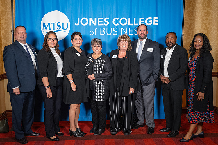Jones College of Business Dean Joyce Heames, fourth from left, poses with representatives from First Horizon Bank at the Jones College of Business Leadership Awards Ceremony held Oct. 19, 2023, at Embassy Suites in Murfreesboro, Tenn. First Horizon was a co-sponsor of the awards ceremony. (MTSU photo by Cat Curtis Murphy)