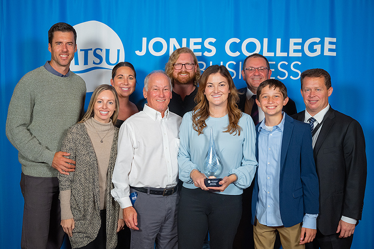 Middle Tennessee State University alumna Jami Averwater, center right holding award, poses with family and supporters at the Jones College of Business Leadership Awards Ceremony held Oct. 19, 2023, at Embassy Suites in Murfreesboro, Tenn. Averwater received the 2023 Jones College Exemplar Award. (MTSU photo by Cat Curtis Murphy)