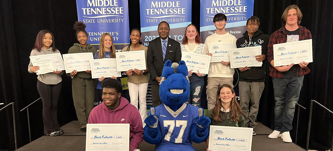 Chattanooga, Tenn.-area students received scholarships to attend Middle Tennessee State University starting in 2024 when they attended the MTSU True Blue Tour recruiting event at The Chattanoogan Hotel in Chattanooga, Tenn., recently. They include front row, from left, Reginald Glover, MTSU mascot Lightning and Anna Catherine Crutchfield; back row, from left, Kyera Reese, Amelya Robinson, Mary Caroline Winters, Shanecca Charmelua, MTSU President Sidney A. McPhee, Alexa Quinn, Jack Quinn, Ta’Marion Woodgett and Kyler Delaney. (MTSU file photo by Andrew Oppmann)