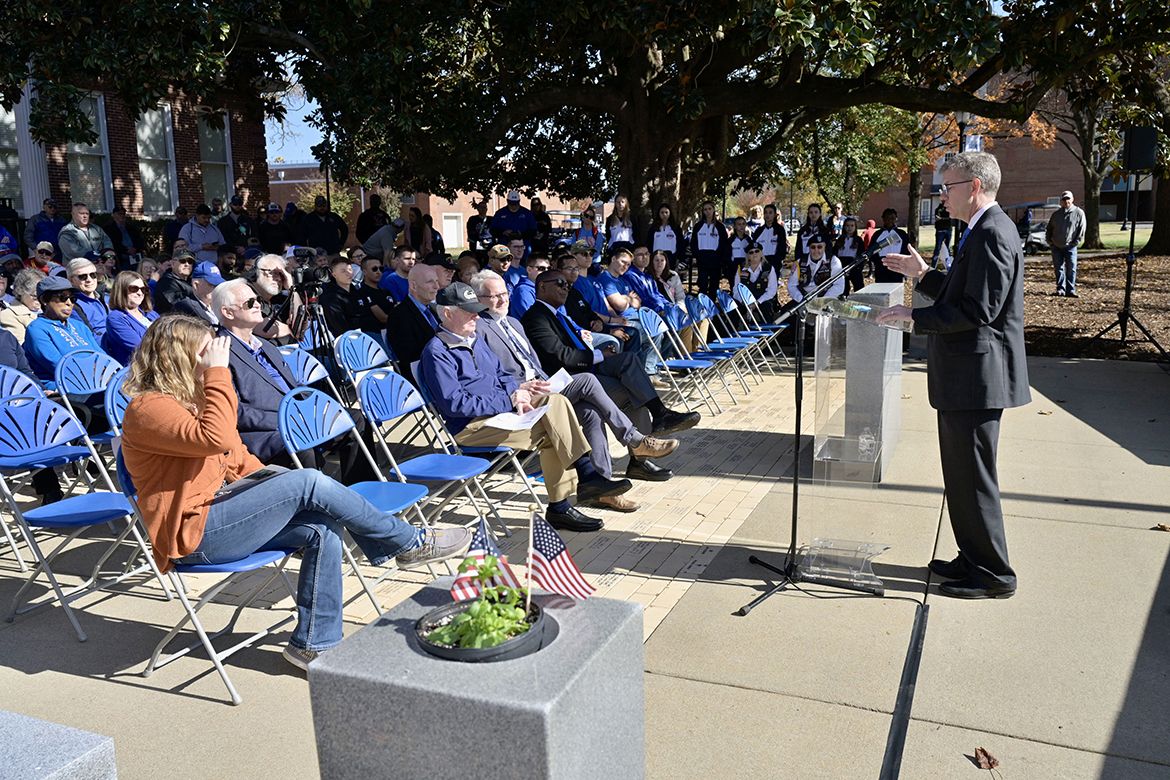 Middle Tennessee State University English Department Chair and U.S. Navy veteran Stephen E. Severn shares a story tying in the MTSU student-run Blue Raider American Veterans Organization, or BRAVO, of which he is an advisor, during the Military Memorial Service kicking off the 41st annual Salute to Veterans and Armed Forces game activities. The event was held at the Military Memorial outside the Tom H. Jackson Building. (MTSU photo by Andy Heidt)