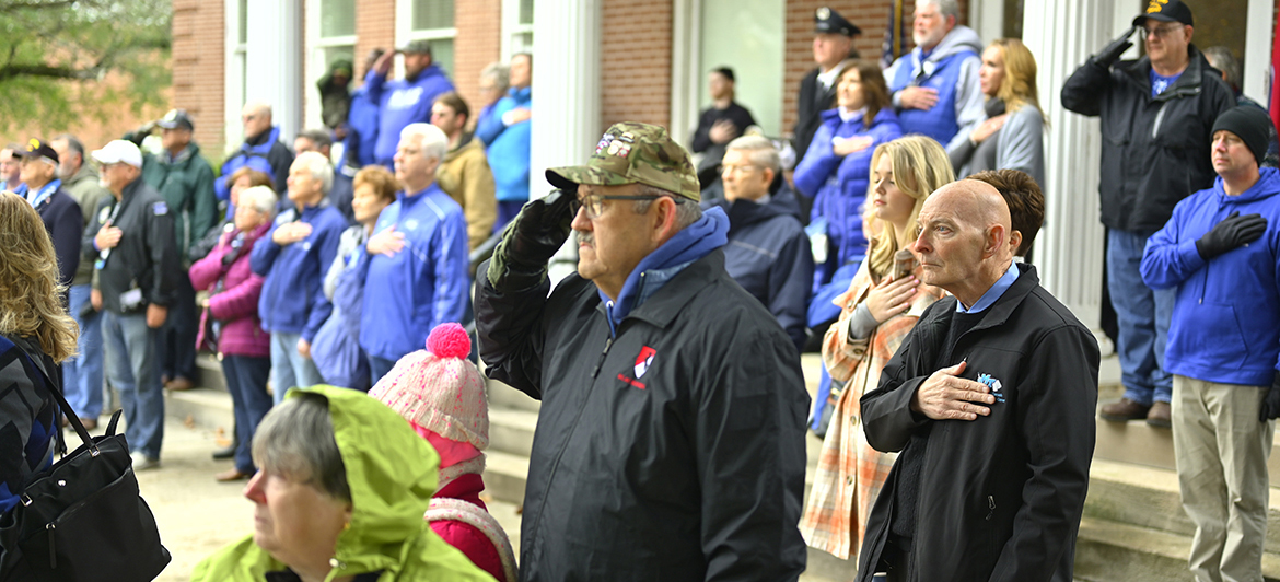 Veterans, including Middle Tennessee State University's Keith M. Huber, foreground right, listen to the playing of reveille during an early portion of the 40th annual Salute to Veterans and Armed Forces game 's Memorial Service at the MTSU Veterans Memorial sight in November 2022. MT Athletics and the MTSU Charlie and Hazel Daniels Veterans and Military Family Center will host numerous activities as part of the MT Blue Raider-FIU football game to celebrate veterans and active-duty military. Huber is senior adviser for veterans and leadership activities. (MTSU photo by Cat Curtis Murphy)