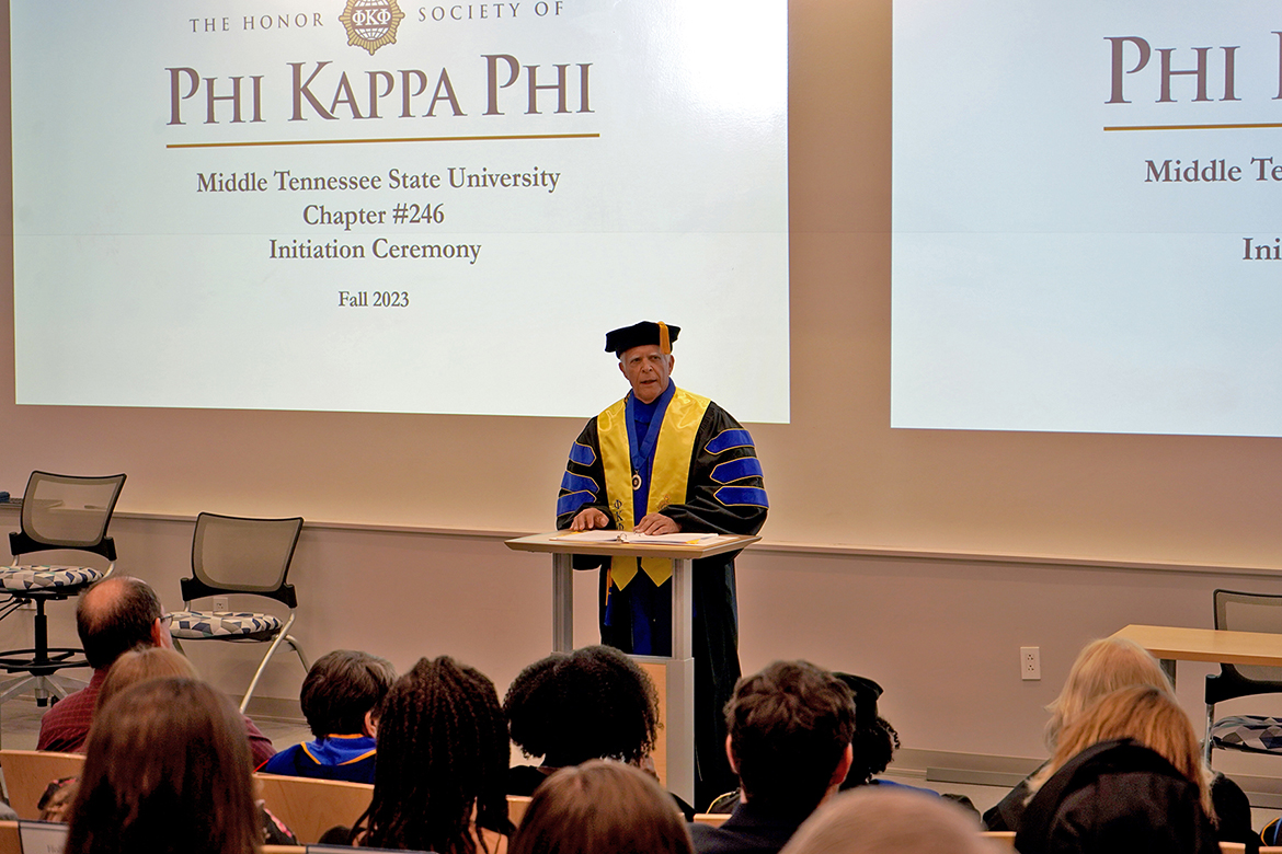 David Foote, president of the MTSU Chapter 246 of Phi Kappa Phi and a management professor in the Jones College of Business, speaks at the Fall 2023 initiation ceremony. (MTSU photo by Robin E. Lee)