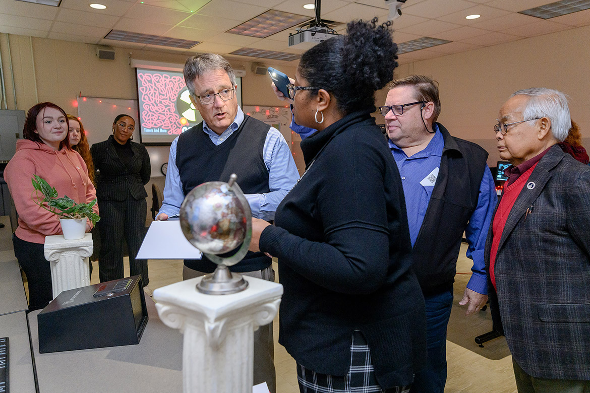 Middle Tennessee State University College of Liberal Arts Dean Leah Lyons, front, talks to University Provost Mark Byrnes, center, as Rutherford County Commissioner Chantho Sourinho, far right, and American Red Cross Heart of Tennessee Chapter Executive Director John Mitchell, second from right, listen in on an escape room-style project led by students in professor Amy Atchison’s Humanitarian Aid and Crisis class, from left, Mallory Case, Emily Davenport and Alandra McMillan. (MTSU photo by J. Intintoli)