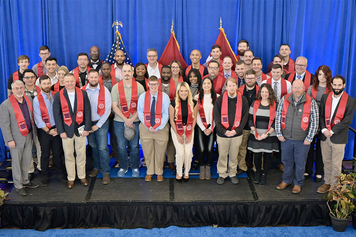 Middle Tennessee State University student-veterans pose for a group photo Thursday, Dec. 14, during the Graduating Veterans Stole Ceremony in the second-floor atrium of the Miller Education Center on Bell Street. Nearly 80 student-veterans will graduate Saturday, Dec. 16, in MTSU’s Murphy Center. (MTSU photo by Andy Heidt)