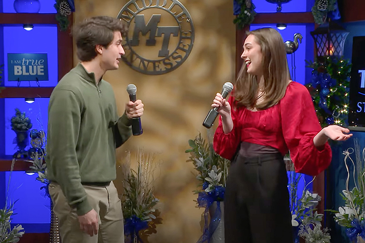 Middle Tennessee State University students Moira Cagle, right, and Logan Purcell sing “Baby, It’s Cold Outside” from the 2023 “Joys of the Season” holiday-themed arts showcase from the College of Liberal Arts, premiering Monday, Dec. 4, on the university’s True Blue TV, Facebook page and YouTube channel. The 30-minute program will air all month on True Blue TV and other area media outlets. (MTSU screenshot)