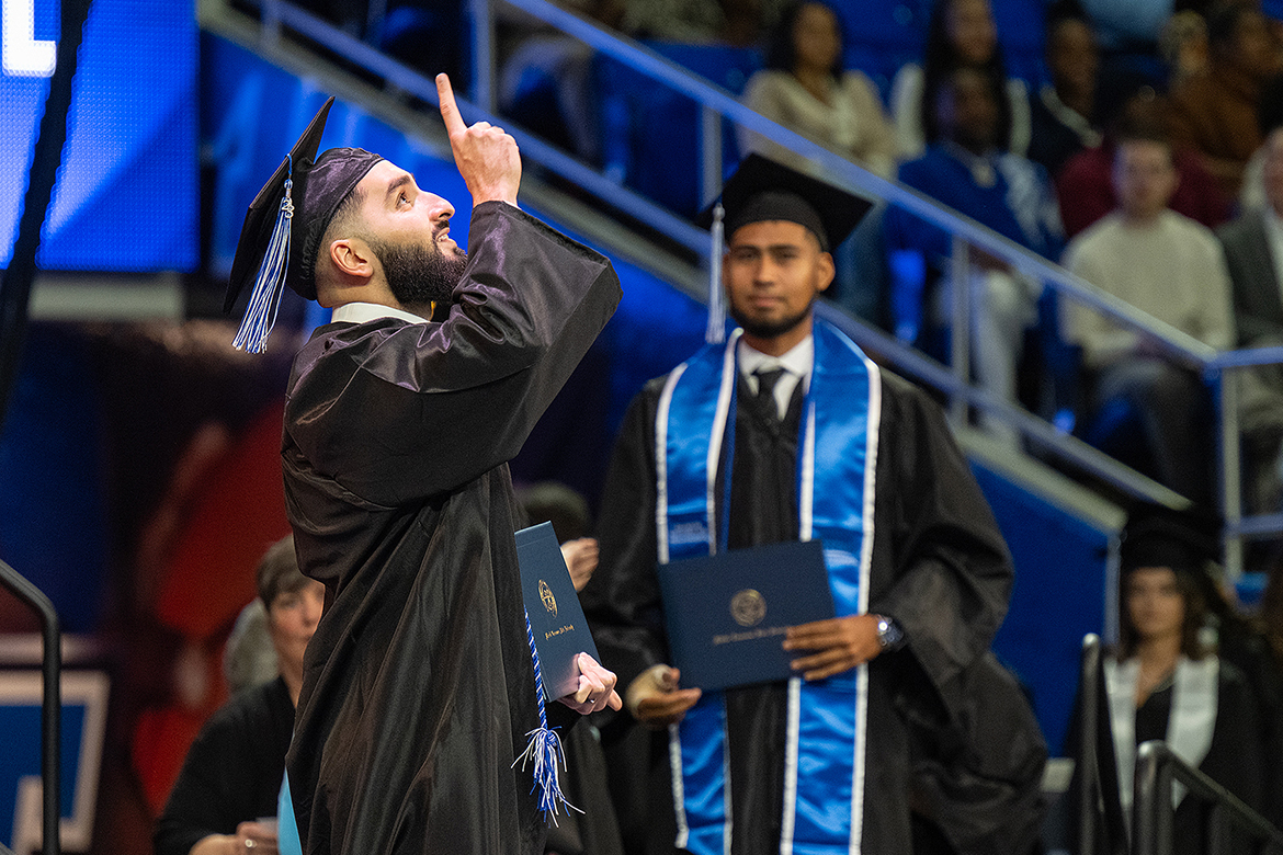 A member of Middle Tennessee State University’s Class of 2023 expresses praise after receiving his diploma inside Murphy Center during MTSU’s fall commencement ceremonies. MTSU presented 1,761 undergrad and graduate degrees to students in two ceremonies held Dec. 16. (MTSU photo by Cat Curtis Murphy)